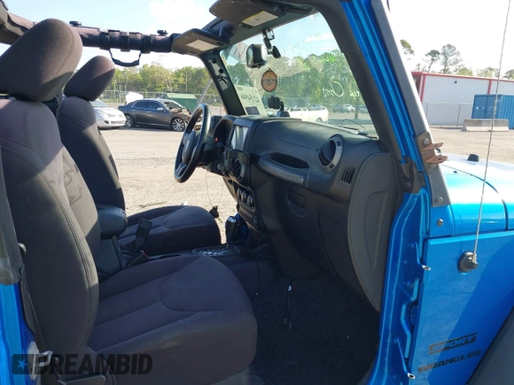 2015 Jeep Wrangler Sport z VIN 1C4AJWAG8FL550859, wystawiony jako IAAI lot #42154946 z przebiegiem 143 658 mil mil oraz . Historia ofert i sprzedaży dostępna na DreamBid. Obrazek 5.