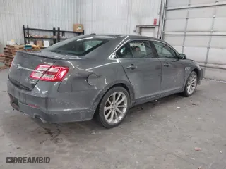 2015 Ford Taurus Limited with VIN 1FAHP2J8XFG192225, listed as a IAAI auction lot 41324244 with 100,395 mi miles. Bid and sale history available at carsss.com. Image 4.