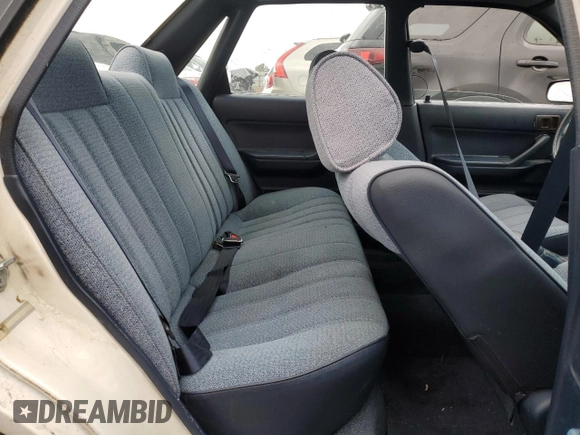 1991 Toyota Camry z VIN 4T1SV24E5MU355011, wystawiony jako Copart lot #51021185 z przebiegiem 135 881 mil mil oraz Czysty tytuł • Clean title. Historia ofert i sprzedaży dostępna na DreamBid. Obrazek 10.