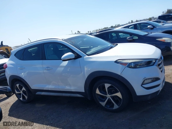 2017 Hyundai Tucson Value with VIN KM8J33A27HU438902, listed as a IAAI auction lot 41835502 with 84,885 mi miles. Bid and sale history available at carsss.com. Image 13.