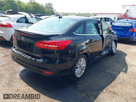 2018 Ford Focus Titanium with VIN 1FADP3J22JL220986, listed as a IAAI auction lot 42410253 with 40,791 mi miles and . Bid and sale history available at DreamBid. Image 4.