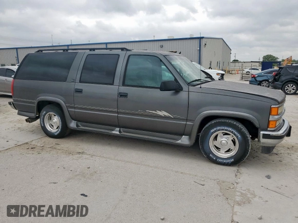 1999 Chevrolet Suburban with VIN 1GBEC16R0XJ434453, listed as a Copart auction lot 54711725 with 179,597 mi miles and Clean title. Bid and sale history available at DreamBid. Image 4.