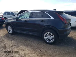 2024 Cadillac XT4 AWD Luxury with VIN 1GYFZBR4XRF199970, listed as a Copart auction lot 71496774 with 4,512 mi miles and Salvage Title. Bid and sale history available at carsss.com. Image 2.