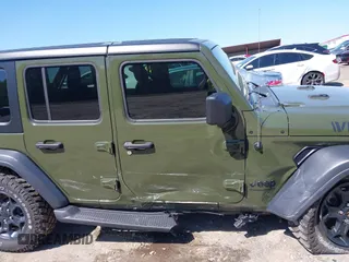 2023 Jeep Wrangler Sport S with VIN 1C4HJXDN0PW695795, listed as a IAAI auction lot 41974691 with 32,734 mi miles and . Bid and sale history available at DreamBid. Image 13.