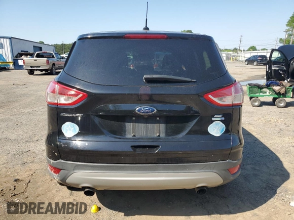 2016 Ford Escape SE with VIN 1FMCU9G93GUA77437, listed as a Copart auction lot 51807905 with 128,261 mi miles and Salvage Title. Bid and sale history available at DreamBid. Image 6.
