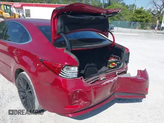 2014 Lexus ES 300h Hybrid with VIN JTHBW1GG4E2064553, listed as a IAAI auction lot 42002058 with 180,455 mi miles. Bid and sale history available at carsss.com. Image 6.