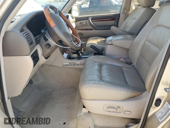 2001 Lexus LX 470 z VIN JTJHT00W213507042, wystawiony jako Copart lot #52634195 z przebiegiem 179 707 mil mil oraz Tytuł czysty. Historia ofert i sprzedaży dostępna na DreamBid. Obrazek 7.