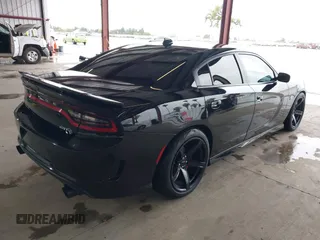 2019 Dodge Charger SRT Hellcat with VIN 2C3CDXL97KH552439, listed as a IAAI auction lot 41813879 with 58,921 mi miles and . Bid and sale history available at DreamBid. Image 4.