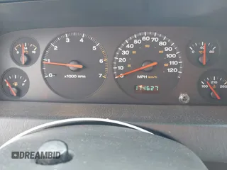 2003 Jeep Grand Cherokee Laredo z VIN 1J4GX48S33C519404, wystawiony jako IAAI lot #42164364 z przebiegiem 174 627 mil mil oraz . Historia ofert i sprzedaży dostępna na DreamBid. Obrazek 7.