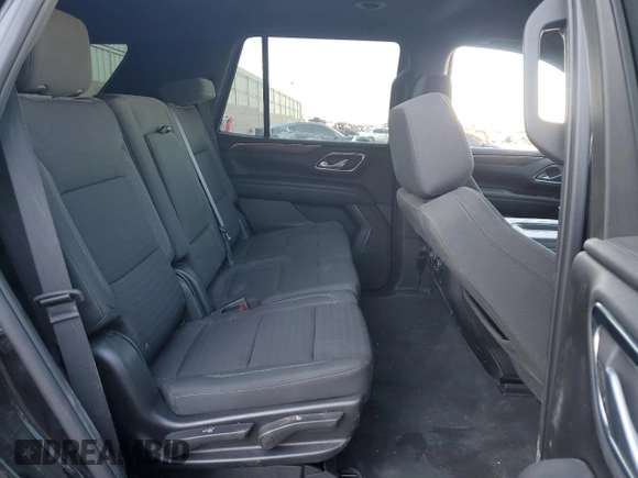 2023 Chevrolet Tahoe LS z VIN 1GNSKMKD4PR184687, wystawiony jako Copart lot #52014155 z przebiegiem 27 363 mil mil oraz Szkoda całkowita • Salvage title. Historia ofert i sprzedaży dostępna na DreamBid. Obrazek 11.