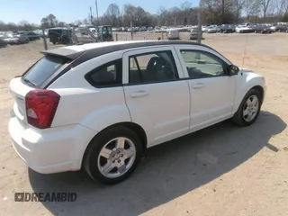 2009 Dodge Caliber SXT with VIN 1B3HB48A19D259105, listed as a IAAI auction lot 41881974 with 127,096 mi miles and . Bid and sale history available at DreamBid. Image 4.