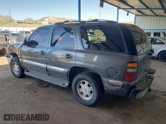 2001 GMC Yukon SLT z VIN 1GKEK13T21J165558, wystawiony jako Copart lot #52200565 z przebiegiem 291 699 mil mil oraz Szkoda całkowita • Salvage title. Historia ofert i sprzedaży dostępna na DreamBid. Obrazek 2.