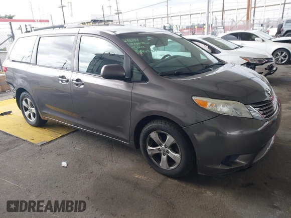 2015 Toyota Sienna LE AAS with VIN 5TDKK3DC8FS585957, listed as a IAAI auction lot 41888825 with 157,364 mi miles and . Bid and sale history available at DreamBid. Image 1.