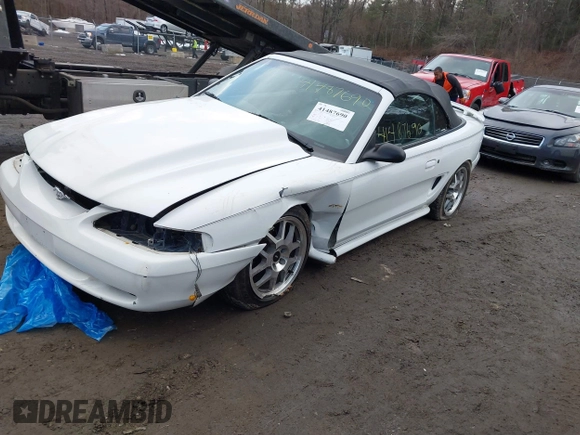 1996 Ford Mustang GT with VIN 1FALP45X7TF201553, listed as a IAAI auction lot 41487690 with 102,015 mi miles. Bid and sale history available at carsss.com. Image 2.