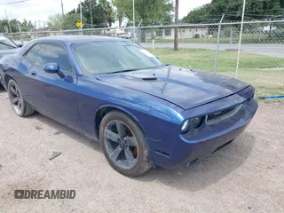 2009 Dodge Challenger R/T z VIN 2B3LJ54T89H621301, wystawiony jako IAAI lot #42410541 z przebiegiem 104 200 mil mil oraz . Historia ofert i sprzedaży dostępna na DreamBid. Obrazek 1.