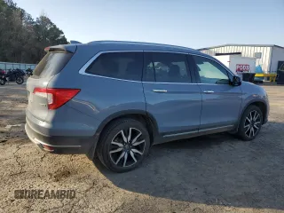 2022 Honda Pilot Touring 7-Passenger with VIN 5FNYF5H69NB031537, listed as a Copart auction lot 48986685 with 88,301 mi miles and Salvage title. Bid and sale history available at DreamBid. Image 3.