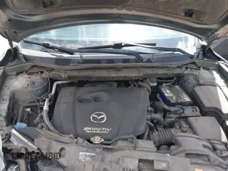 2014 Mazda CX-5 Sport with VIN JM3KE2BE0E0411377, listed as a IAAI auction lot 42143229 with 137,384 mi miles and . Bid and sale history available at carsss.com. Image 10.