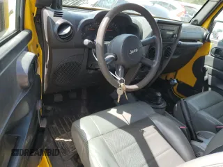 2009 Jeep Wrangler X with VIN 1J4FA241X9L765664, listed as a Copart auction lot 51802065 with 137,053 mi miles and Salvage Title. Bid and sale history available at DreamBid. Image 8.