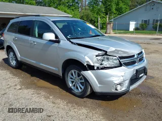 2013 Dodge Journey SXT z VIN 3C4PDCBG4DT564290, wystawiony jako IAAI lot #42225485 z przebiegiem 69 029 mil mil oraz . Historia ofert i sprzedaży dostępna na DreamBid. Obrazek 1.