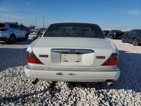 1995 Jaguar XJ with VIN SAJKX1745SC739290, listed as a Copart auction lot 82887524 with Not provided miles and Salvage title. Bid and sale history available at DreamBid. Image 6.
