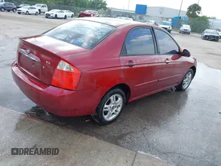 2004 Kia Spectra LX with VIN KNAFE121545021648, listed as a IAAI auction lot 41842471 with 211,436 mi miles. Bid and sale history available at carsss.com. Image 4.