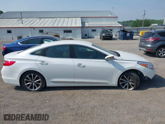 2015 Hyundai Azera z VIN KMHFG4JG3FA447672, wystawiony jako IAAI lot #42474930 z przebiegiem 125 425 mil mil oraz . Historia ofert i sprzedaży dostępna na DreamBid. Obrazek 13.