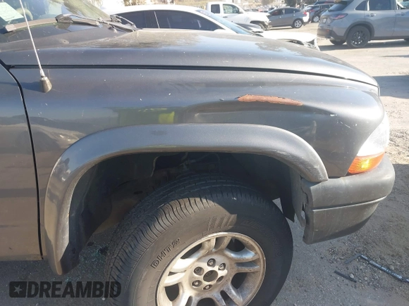 2003 Dodge Dakota SLT with VIN 1D7HG48N33S248568, listed as a IAAI auction lot 41834084 with 153,001 mi miles and . Bid and sale history available at DreamBid. Image 6.
