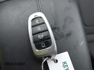 2022 Hyundai Tucson SEL z VIN 5NMJBCAE9NH015906, wystawiony jako IAAI lot #42169136 z przebiegiem 28 009 mil mil oraz . Historia ofert i sprzedaży dostępna na DreamBid. Obrazek 11.