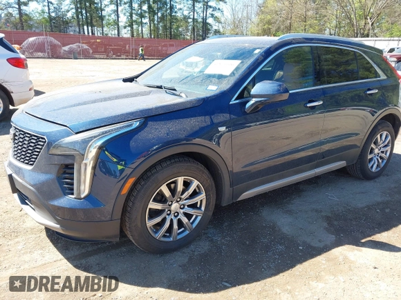 2019 Cadillac XT4 FWD Premium Luxury z VIN 1GYFZCR47KF109394, wystawiony jako IAAI lot #41864606 z przebiegiem 98 425 mil mil oraz . Historia ofert i sprzedaży dostępna na DreamBid. Obrazek 2.