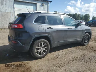 2015 Jeep Cherokee North with VIN 1C4PJMCSXFW582677, listed as a Copart auction lot 67999984 with 220,045 mi miles and Salvage Title. Bid and sale history available at carsss.com. Image 3.