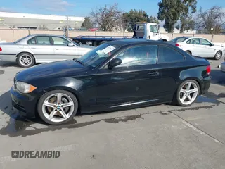 2008 BMW 1 Series 135i with VIN WBAUC73548VF25411, listed as a IAAI auction lot 41479409 with 153,643 mi miles. Bid and sale history available at carsss.com. Image 2.