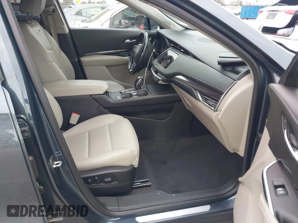 2019 Cadillac XT4 AWD Luxury with VIN 1GYFZBR41KF160352, listed as a IAAI auction lot 42047477 with 58,850 mi miles and . Bid and sale history available at DreamBid. Image 5.