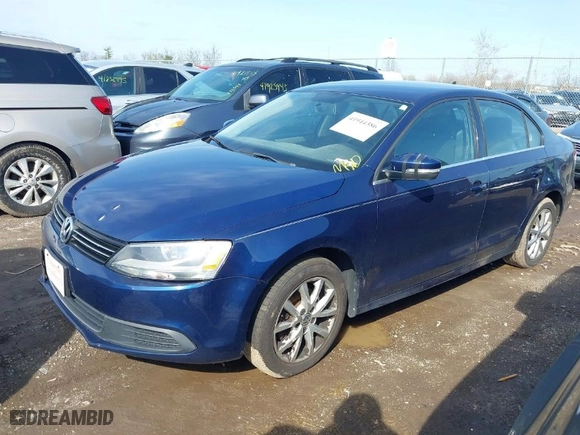 2014 Volkswagen Jetta Sedan SE with VIN 3VWD17AJ9EM303584, listed as a IAAI auction lot 41944386 with 130,921 mi miles. Bid and sale history available at carsss.com. Image 2.