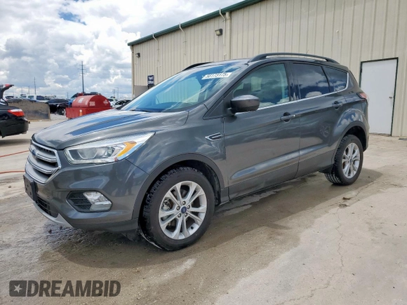 2017 Ford Escape SE z VIN 1FMCU9G91HUE17654, wystawiony jako Copart lot #56173175 z przebiegiem 97 678 mil mil oraz Czysty tytuł • Clean title. Historia ofert i sprzedaży dostępna na DreamBid. Obrazek 1.