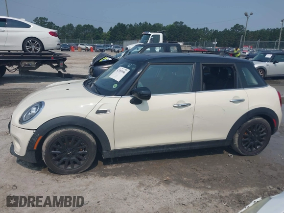 2020 MINI Hardtop 4 Door Cooper with VIN WMWXU7C01L2M54710, listed as a IAAI auction lot 42385956 with 55,714 mi miles and . Bid and sale history available at DreamBid. Image 14.