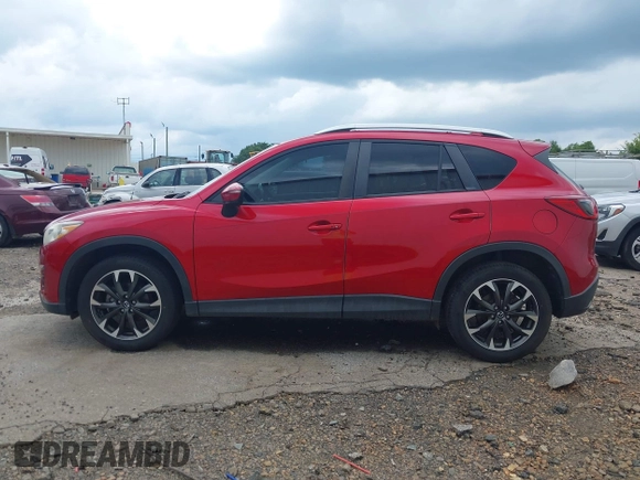 2016 Mazda CX-5 Grand Touring z VIN JM3KE2DY6G0693678, wystawiony jako IAAI lot #42443247 z przebiegiem 127 620 mil mil oraz . Historia ofert i sprzedaży dostępna na DreamBid. Obrazek 14.