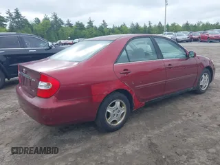 2003 Toyota Camry LE z VIN 4T1BF32K63U050174, wystawiony jako IAAI lot #42260843 z przebiegiem 210 486 mil mil oraz . Historia ofert i sprzedaży dostępna na DreamBid. Obrazek 4.
