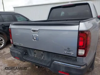 2018 Honda Ridgeline RTL with VIN 5FPYK3F52JB002649, listed as a IAAI auction lot 42338360 with 68,802 mi miles and . Bid and sale history available at DreamBid. Image 16.