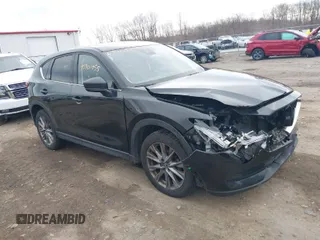 2021 Mazda CX-5 Grand Touring with VIN JM3KFBDMXM0456939, listed as a IAAI auction lot 40901055 with 113,540 mi miles. Bid and sale history available at carsss.com. Image 1.