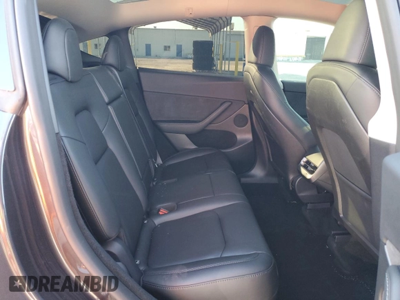 2024 Tesla Model Y with VIN 7SAYGDED7RF108604, listed as a Copart auction lot 48384825 with 24,603 mi miles and Salvage Title. Bid and sale history available at DreamBid. Image 12.