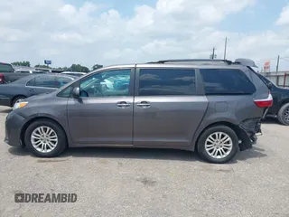 2015 Toyota Sienna XLE with VIN 5TDYK3DCXFS688971, listed as a IAAI auction lot 42127912 with 143,024 mi miles. Bid and sale history available at carsss.com. Image 14.