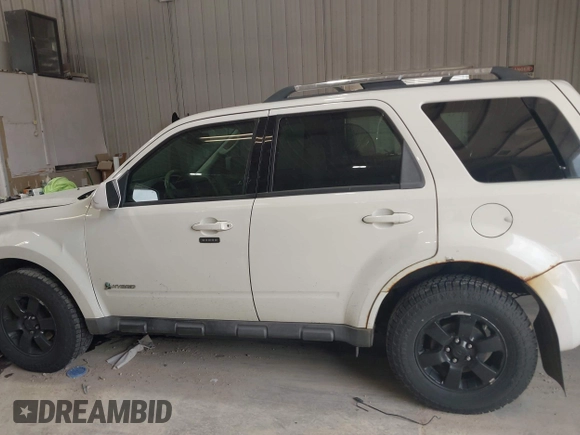 2009 Ford Escape Hybrid z VIN 1FMCU59329KB01081, wystawiony jako IAAI lot #42557114 z przebiegiem 206 972 mil mil oraz . Historia ofert i sprzedaży dostępna na DreamBid. Obrazek 14.