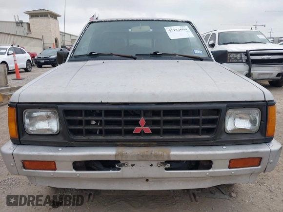 1990 Mitsubishi Mighty Max with VIN JA7FL24W6LP031144, listed as a IAAI auction lot 42152666 with 212,104 mi miles and . Bid and sale history available at DreamBid. Image 6.