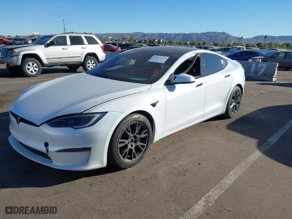 2022 Tesla Model S Plaid with VIN 5YJSA1E64NF479959, listed as a IAAI auction lot 41057673 with 27,203 mi miles. Bid and sale history available at carsss.com. Image 6.