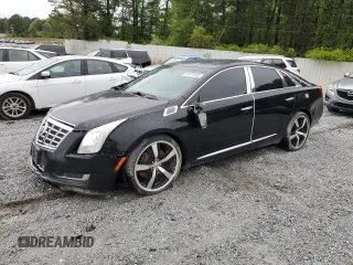 2014 Cadillac XTS Livery z VIN 2G61U5S33E9141464, wystawiony jako Copart lot #52071545 z przebiegiem 231 098 mil mil oraz Tytuł czysty. Historia ofert i sprzedaży dostępna na DreamBid. Obrazek 1.