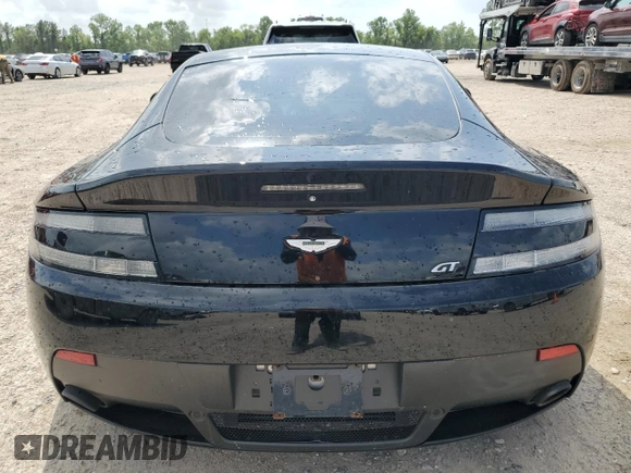 2015 Aston Martin Vantage z VIN SCFEBBAL2FGC18949, wystawiony jako Copart lot #54389965 z przebiegiem Nie podano mil oraz Szkoda całkowita • Salvage title. Historia ofert i sprzedaży dostępna na DreamBid. Obrazek 6.