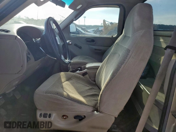 2002 Ford F-150 XL with VIN 1FTRF17232NB22280, listed as a Copart auction lot 62170845 with 216,468 mi miles and Salvage title. Bid and sale history available at DreamBid. Image 7.