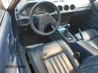 1982 Datsun 280ZX z VIN JN1HZ04S5CX457910, wystawiony jako Copart lot #77132604 z przebiegiem 261 383 mil mil oraz Szkody całkowita. Historia ofert i sprzedaży dostępna na DreamBid. Obrazek 8.