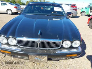 2000 Jaguar XJ with VIN SAJDA23C5YLF19267, listed as a IAAI auction lot 40899052 with 92,553 mi miles and . Bid and sale history available at DreamBid. Image 6.