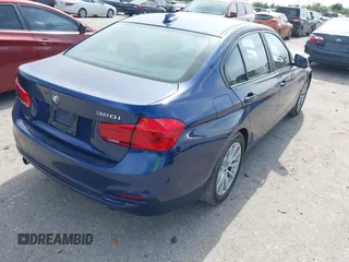 2018 BMW 3 Series 320i with VIN WBA8E1G56JNU92997, listed as a IAAI auction lot 42039869 with 105,085 mi miles. Bid and sale history available at carsss.com. Image 4.